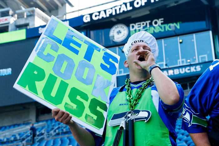 A Seattle Seahawks fan cheers against Denver Broncos quarterback Russell Wilson (not pictured) during pregame warmups at Lumen Field.